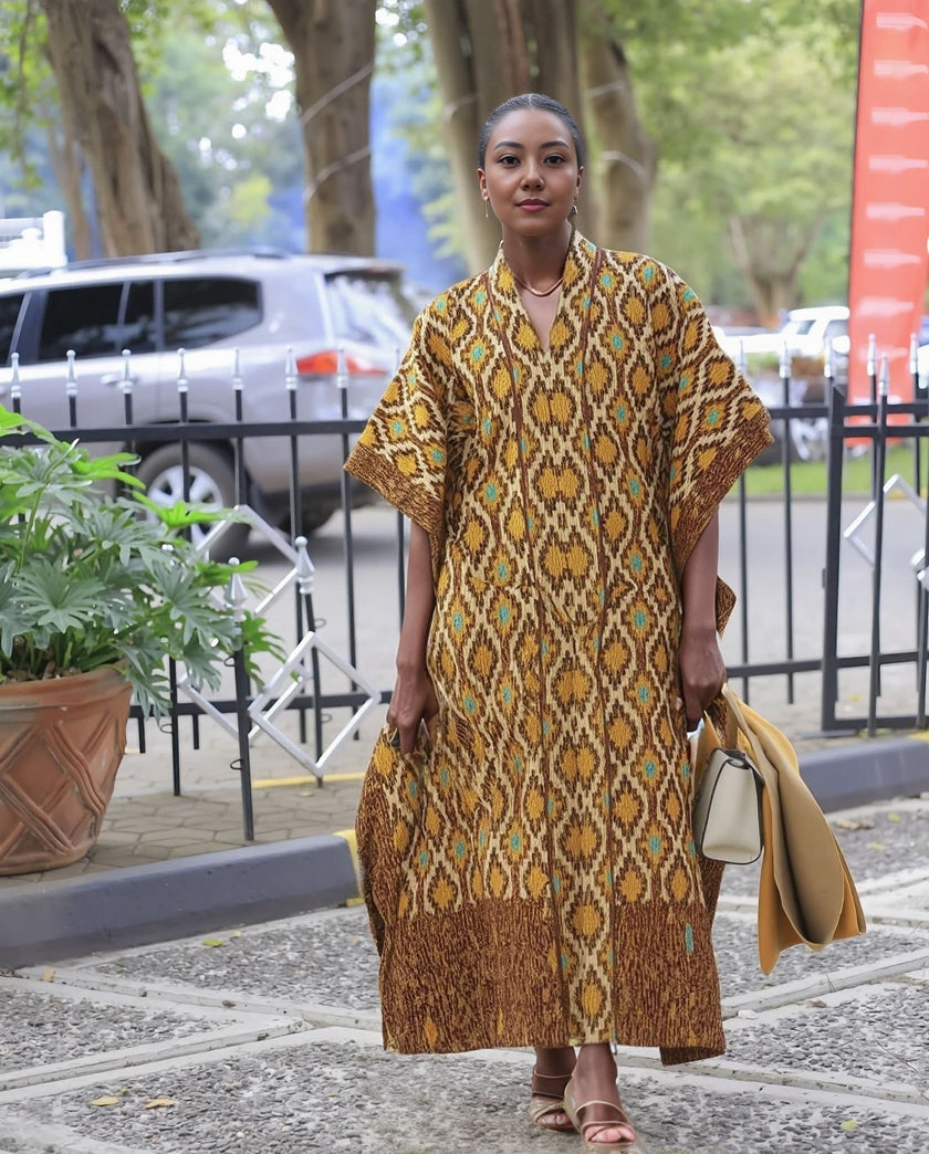 Geometric maxi dress with wide sleeves, mustard and teal pattern, loose fit.