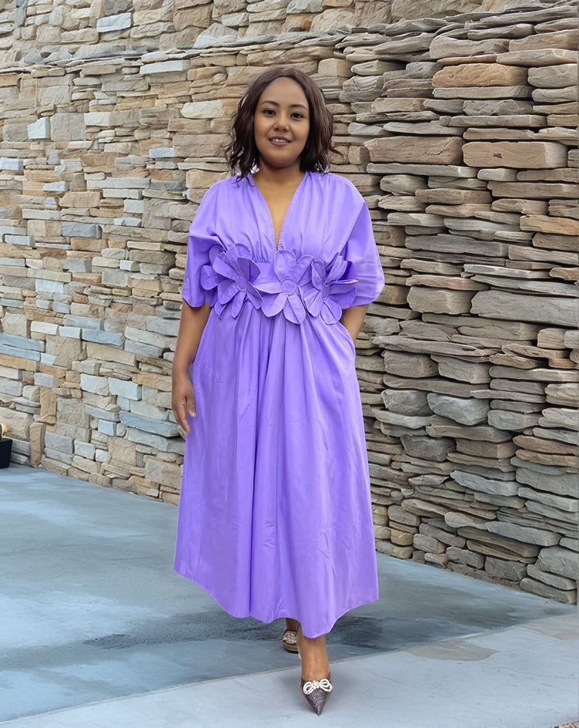 Lavender floral maxi dress with puff sleeves and A-line skirt, V-neck.