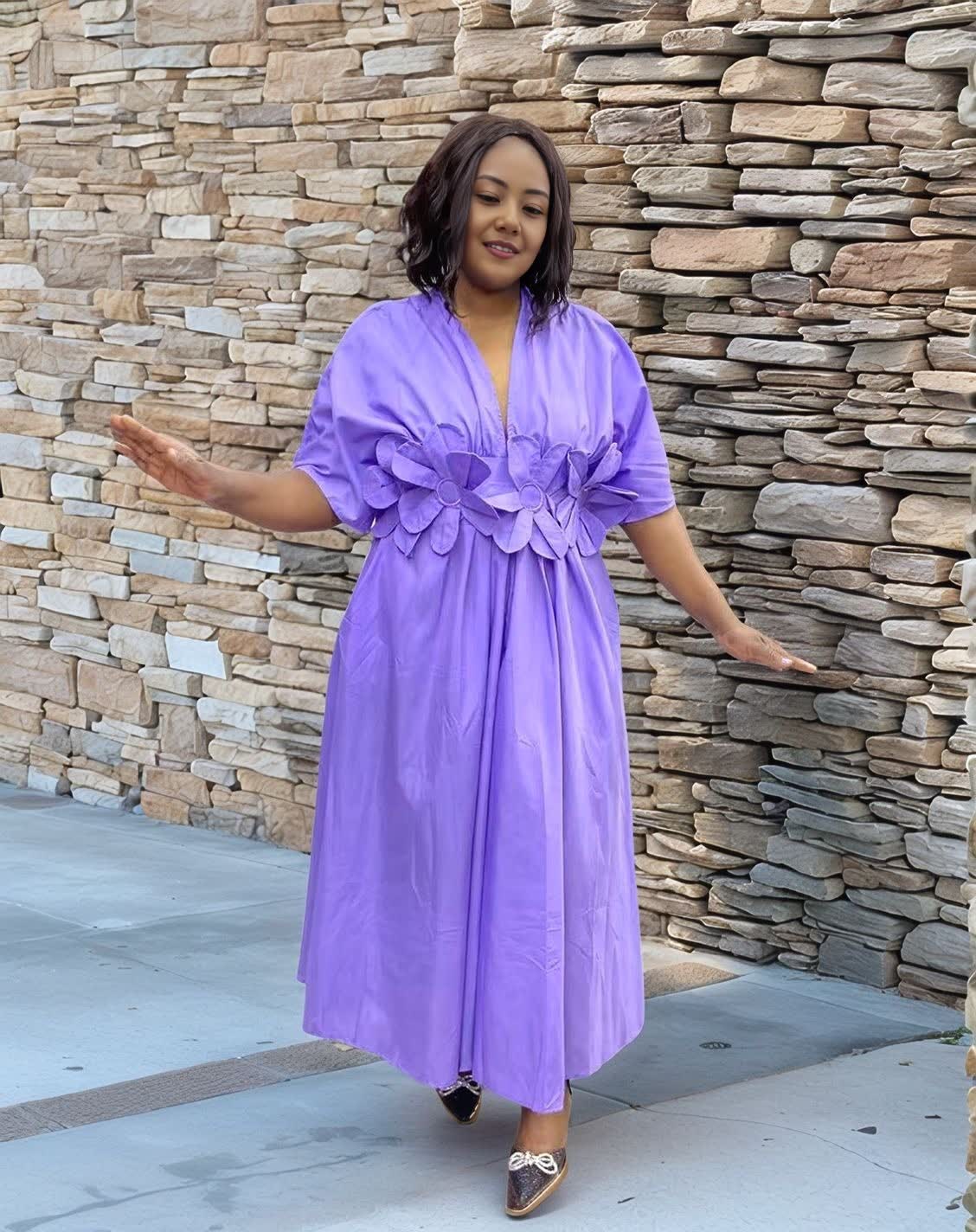 Purple floral maxi dress with puff sleeves and A-line skirt, V-neck.
