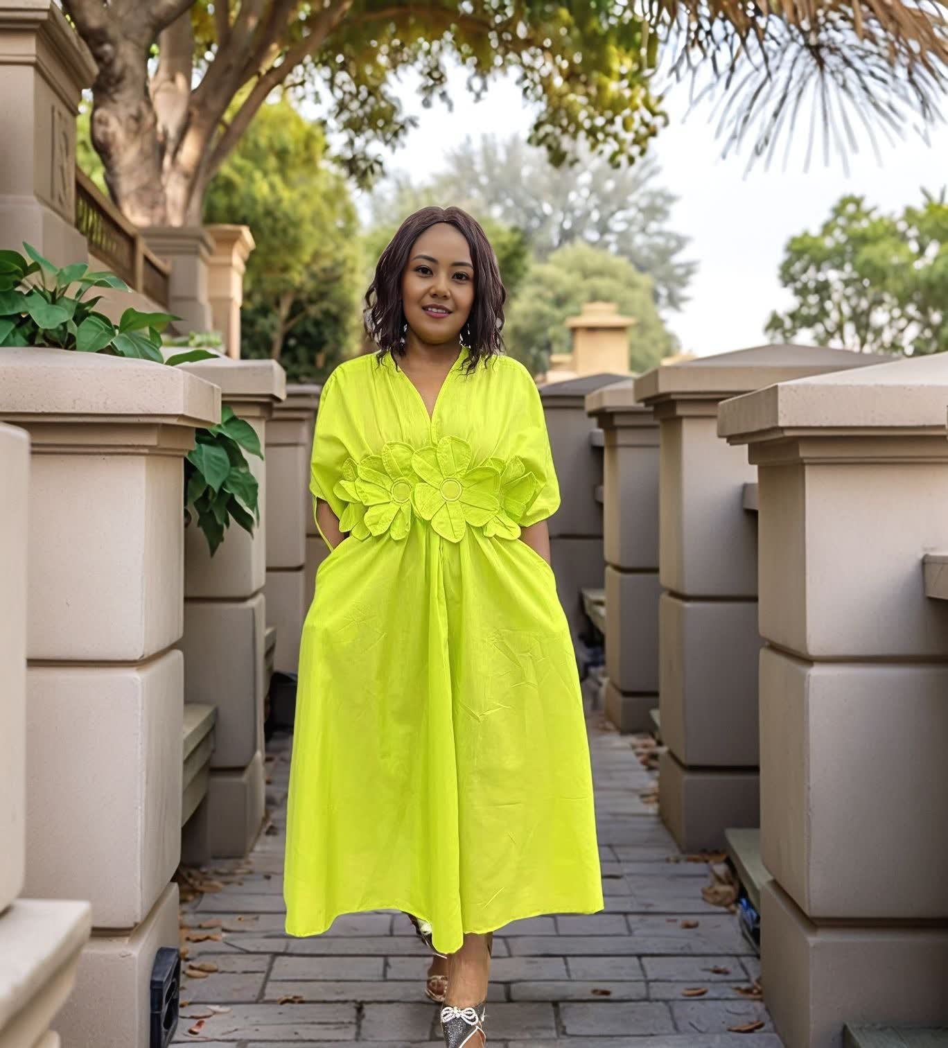 Lime-green floral maxi dress with puff sleeves and A-line skirt, V-neck.