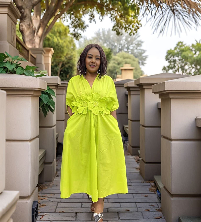 Lime-green floral maxi dress with puff sleeves and A-line skirt, V-neck.