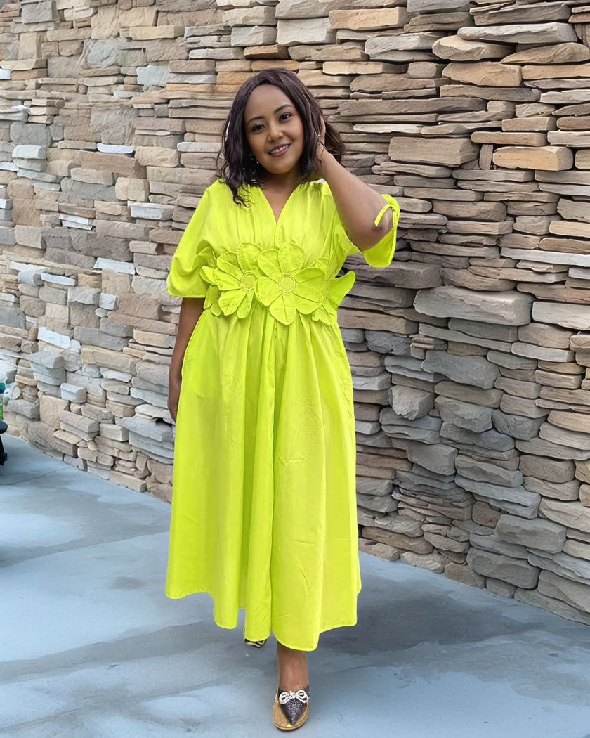 Lime-green floral maxi dress with puff sleeves and A-line skirt, V-neck.