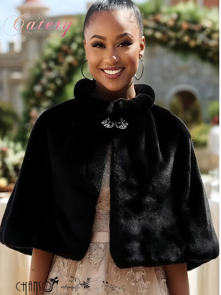 Black faux fur capelet with ruffled collar and silver brooch clasp