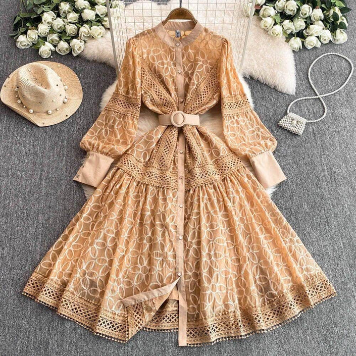Tan lace mini dress with belted waist, long puff sleeves, button front, full tiered skirt.