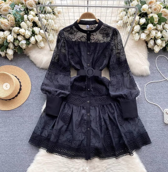 Black lace mini dress with belted waist, button front, long puff sleeves, ruffled hem.