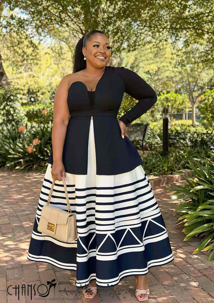Black one-shoulder maxi dress with geometric stripe skirt