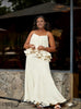 Cream layered ruffle evening dress with spaghetti straps and tiered skirt