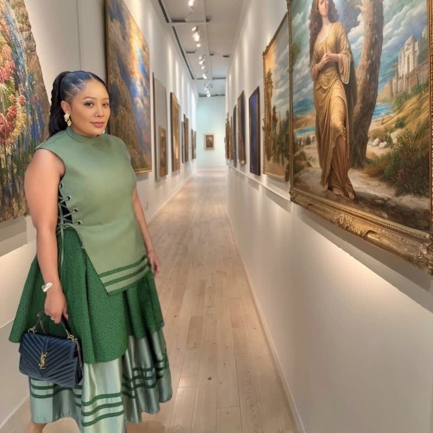 Layered green embroidered skirt with striped border and ruffled hem