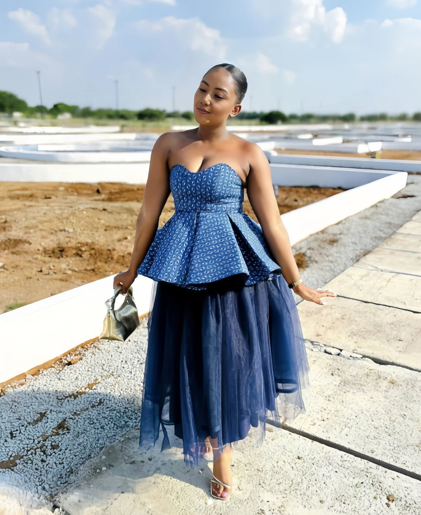 Blue strapless peplum top with textured mesh and layered tulle midi skirt set