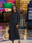 Long-sleeve dark maxi dress with star dot embellishment for evening