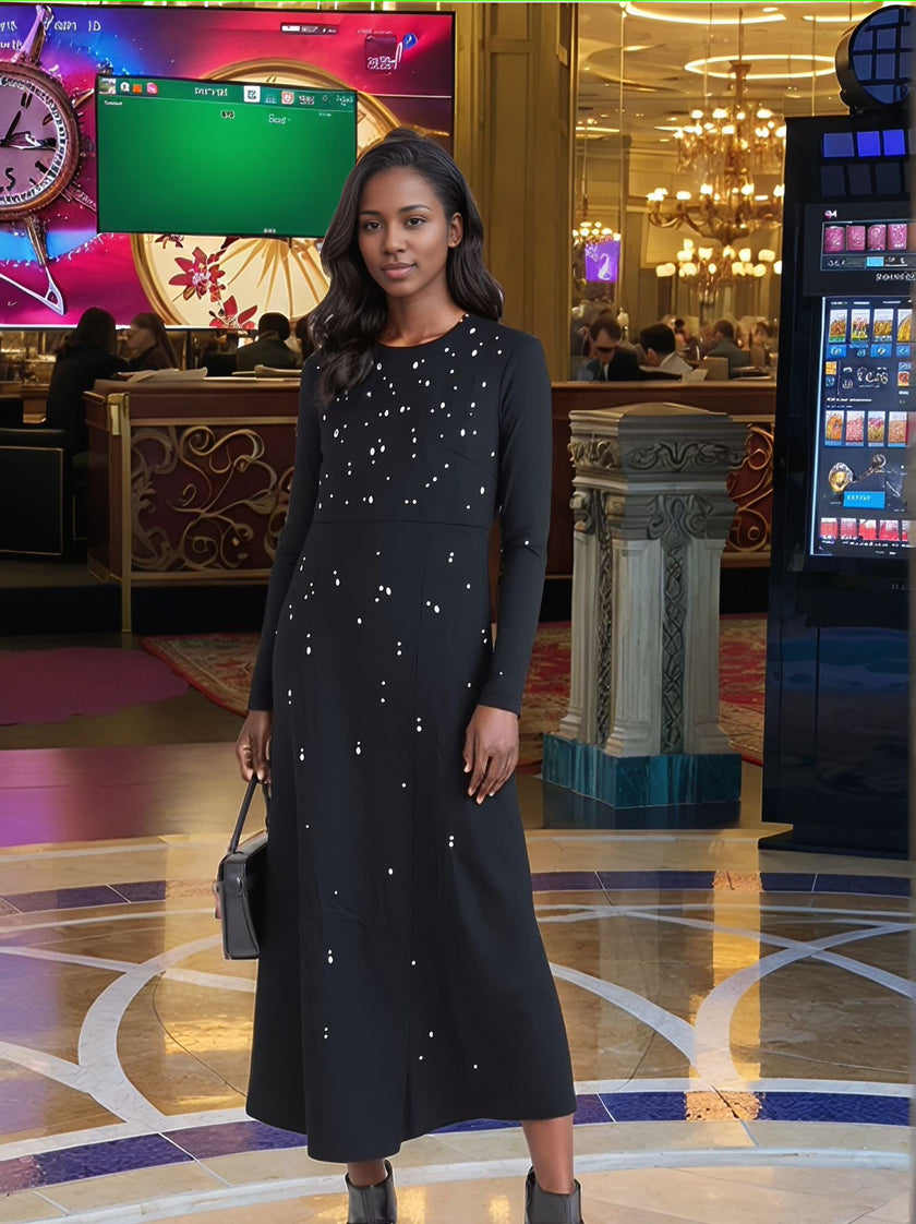Long-sleeve dark maxi dress with star dot embellishment for evening
