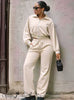 Light nude cropped zip jacket with drawstring pants, long sleeves, elastic waist