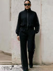 Black zip-up cropped jacket with drawstring track pants, side stripe