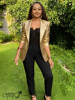 Gold metallic textured blazer with notched lapel and long sleeves.