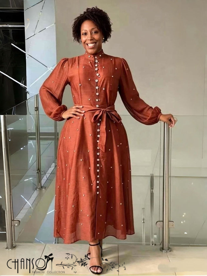Rust midi dress with stand collar, dot beaded detail, balloon sleeves, self-tie waist