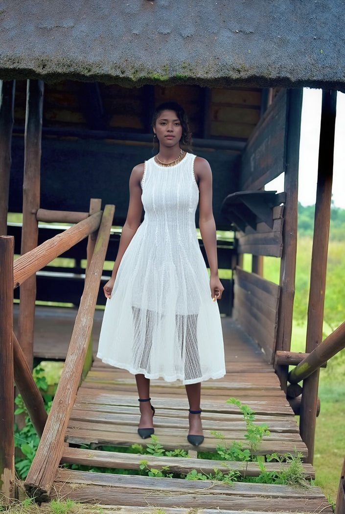 White ribbed knit midi dress, sleeveless with round neckline and pleated skirt