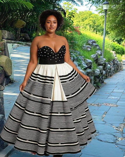 Strapless patchwork maxi dress with black dotted bodice and tiered striped skirt