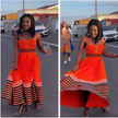 Orange bandeau dress with vertical front zip and striped ruffle hem