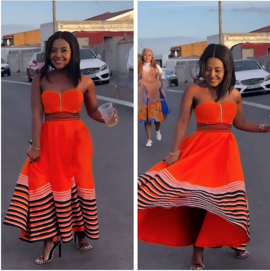 Orange bandeau dress with vertical front zip and striped ruffle hem