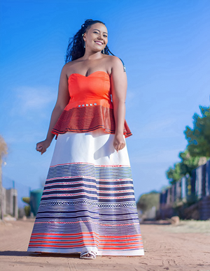 Off-shoulder maxi dress with orange peplum top and red, white, and blue striped skirt