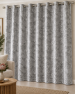 Grey blackout curtain with eyelet rings and a textured geometric cracked-lattice pattern