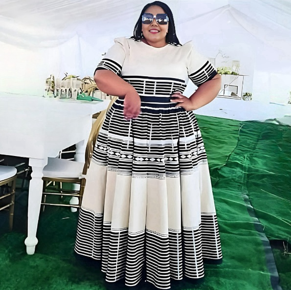 Women’s midi dress with geometric stripe skirt, short sleeves, fitted waist, black and cream