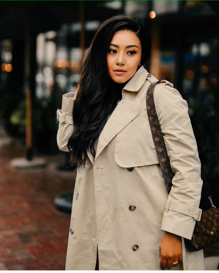 Beige double-breasted maxi coat with lapel collar and buttoned front