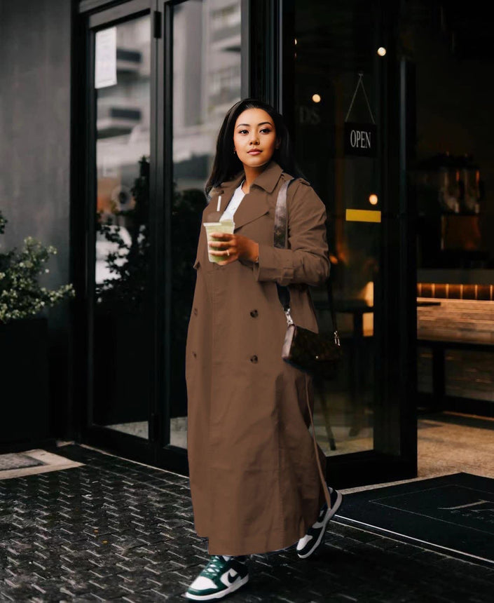Olive-green double-breasted maxi coat with notched lapels and dark buttons