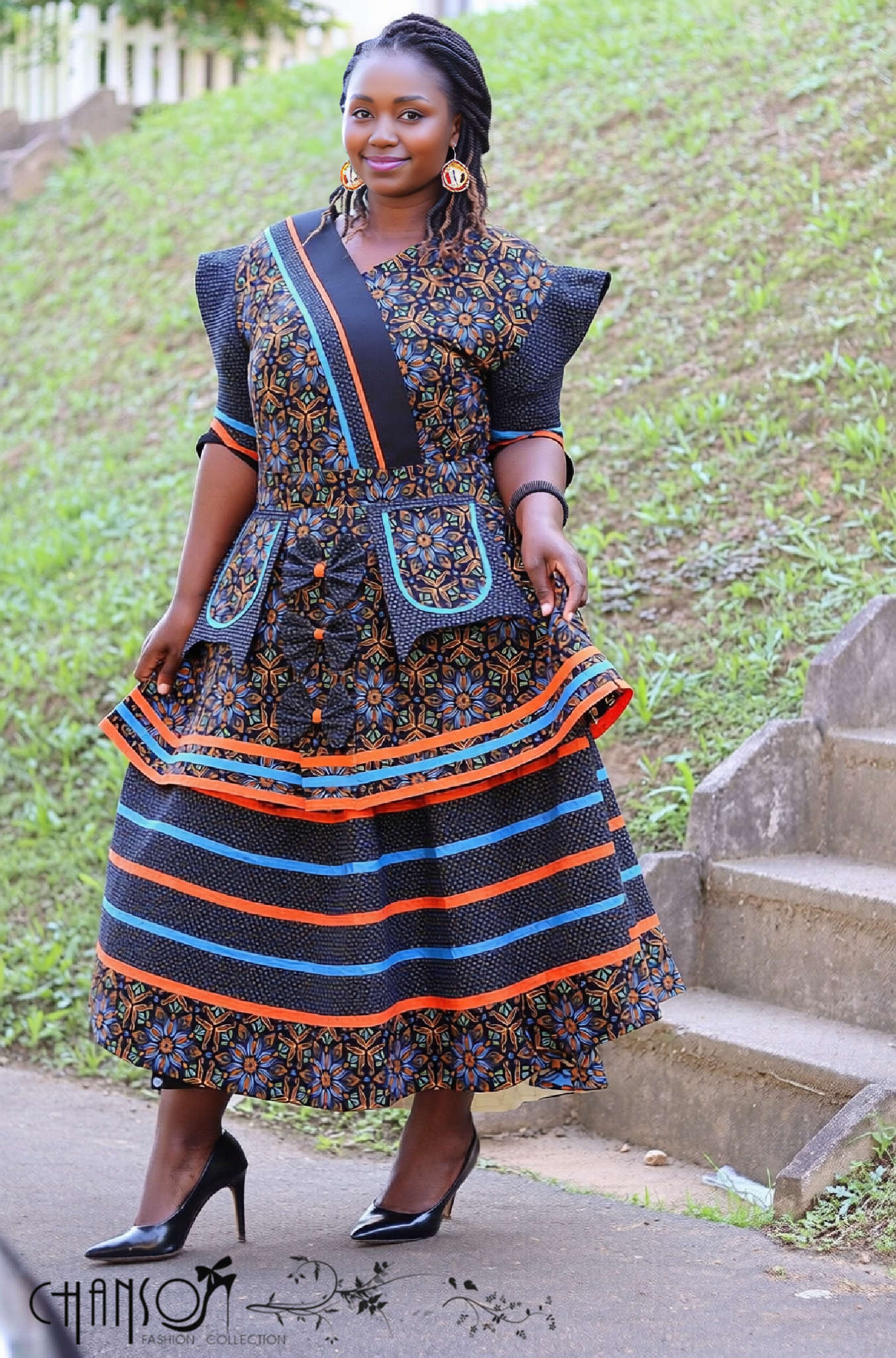 Tiered African print maxi dress with pockets, dark blue pattern and striped trim