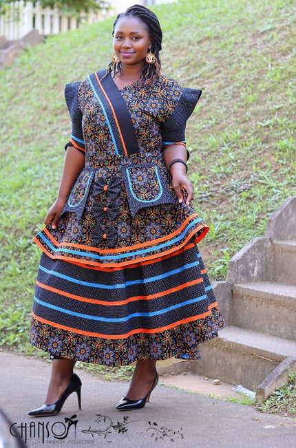 Tiered African print maxi dress with pockets, dark blue pattern and striped trim
