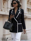 Black double-breasted blazer with white contrast piping and notch lapels