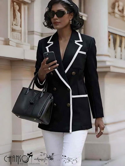 Black double-breasted blazer with contrast white piping and lapels