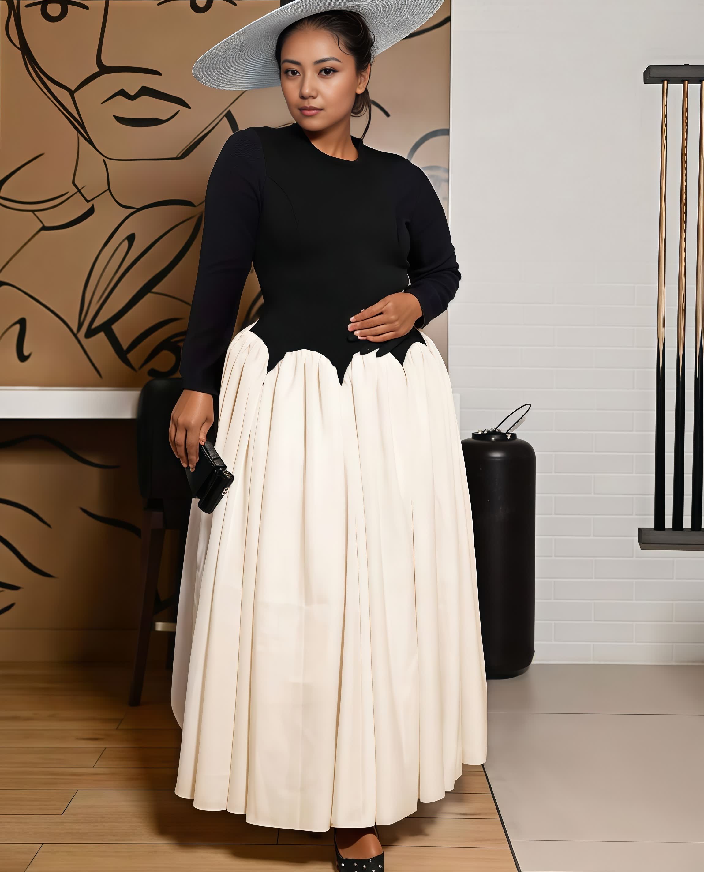 Black long-sleeve bodice with cream pleated midi skirt.