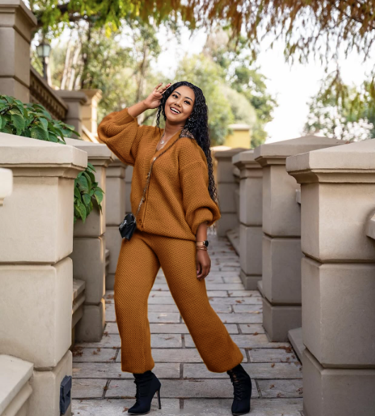 Brown knit twin set with button-front cardigan and matching knit pants.