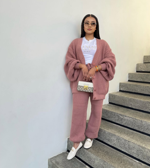 Dusty-rose knit twin set with button-front cardigan and matching knit pants.