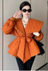 Orange-red belted puffy jacket with quilted shoulders and wide angled collar
