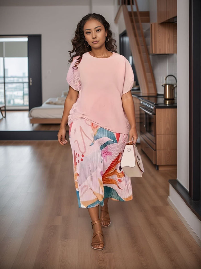 Abstract print pleated midi skirt with matching pink short-sleeve top