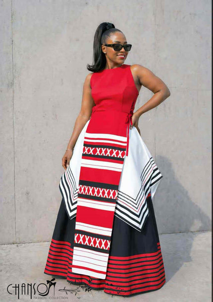 Sleeveless maxi dress with red, black and white geometric striped print, layered skirt