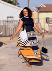 Women’s long dress set with black bodice, cap sleeves, and orange striped graphic skirt