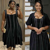 Black twin set dress: beaded sleeveless top with A-line skirt and dotted trim