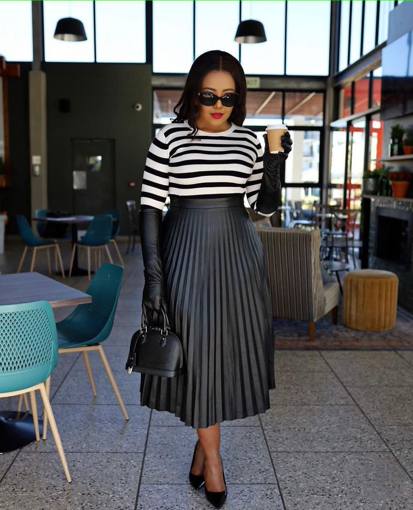 Dark navy pleated midi skirt with gathered waistband and flared A-line silhouette