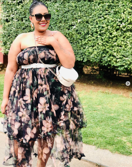 Floral layered skirt in dark base with pink and cream blooms, tiered tulle look.