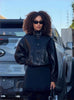Black leather stand-collar jacket with snap buttons and long sleeves
