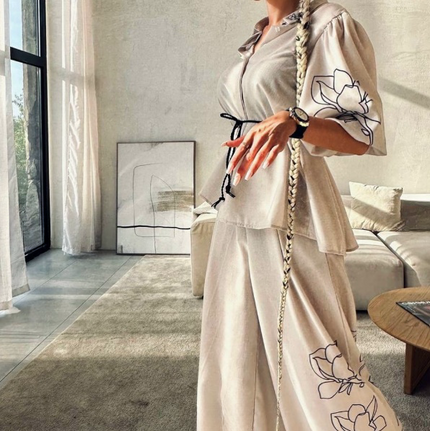 Cream top and wide-leg pants set with floral embroidery and drawstring waist