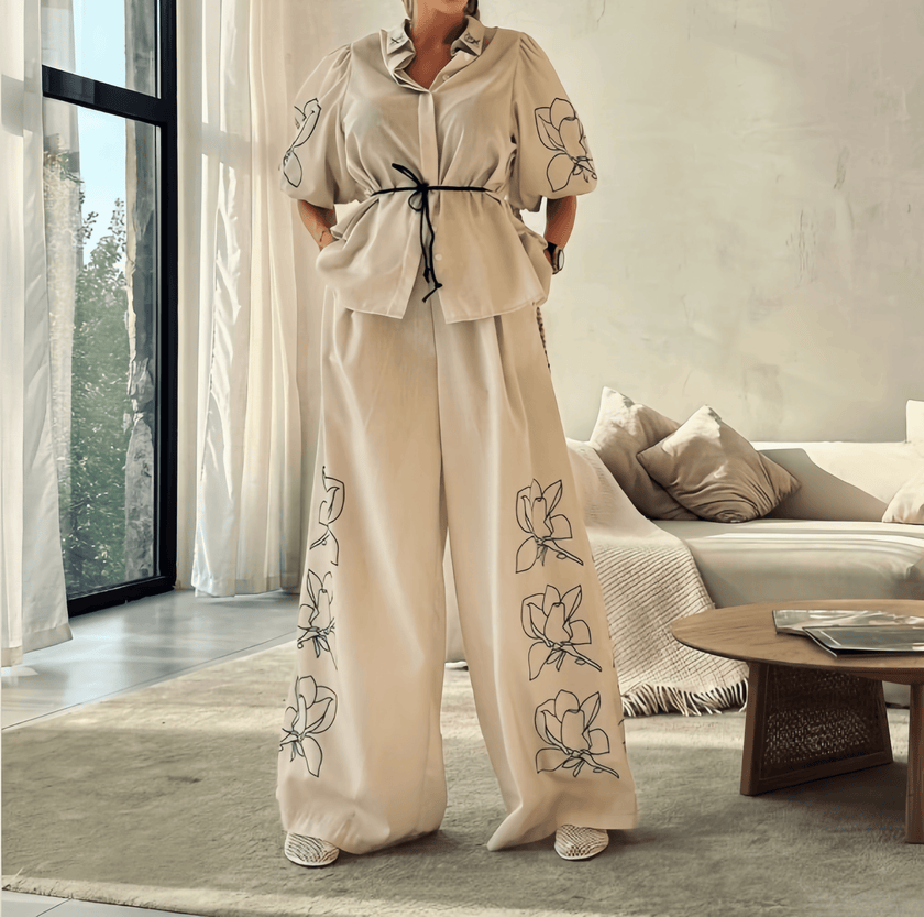 Cream puff-sleeve top and wide-leg pants with floral embroidery on the legs