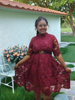 Maroon lace belted evening dress with puff sleeves and textured scalloped skirt hem