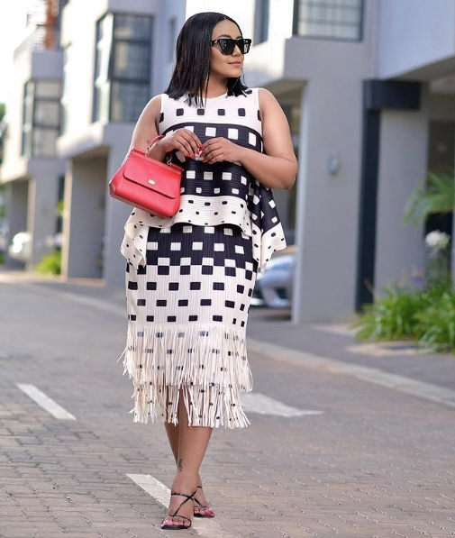 Black geometric fringe skirt with square check pattern and long hem fringe