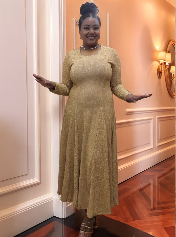 Gold long-sleeve maxi dress with stretch waist, A-line skirt and subtle sheen