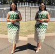 Green geometric fringe skirt with white square pattern and layered hem fringe