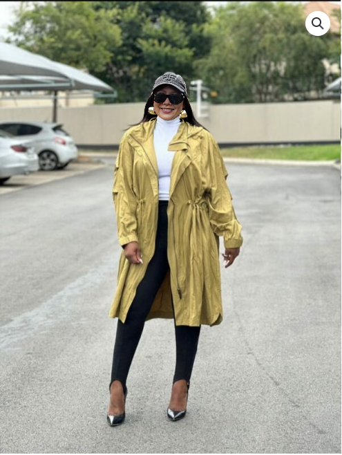 Lightweight olive trench coat with drawstring waist and button front